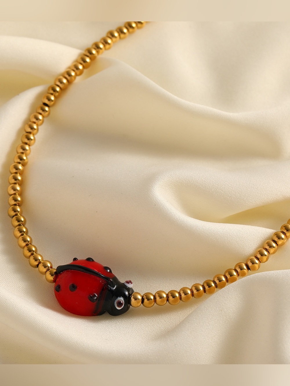 Red Ladybug Pendant Gold Beaded Necklace